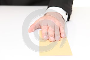 Businessman submits an envelope