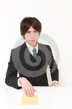 Businessman submits an envelope