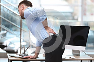 Businessman suffering from back pain