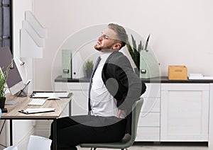 Businessman suffering from back pain