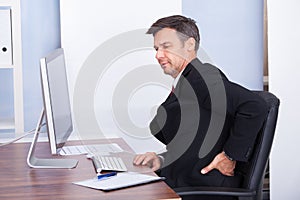 Businessman suffering from back pain