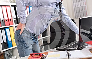 Businessman suffering from back pain