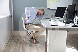 Businessman with lower back ache