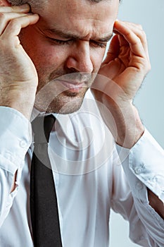Businessman suffering from headache