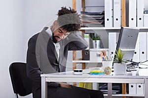 Businessman Suffering From Neck Pain