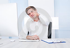 Businessman suffering from pain