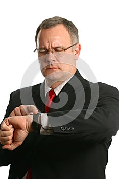 Businessman in suit checking his watch