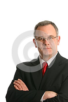 Businessman in suit with crossed arms