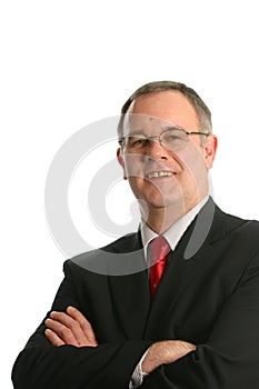 Businessman in suit with crossed arms