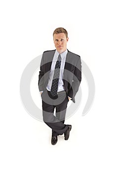 Businessman in suit with hands in pockets