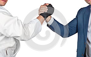 Businessman in suit handshake with judoka boxing gloves in white kimono isolated