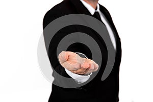 Businessman in suit holds hands with palms up