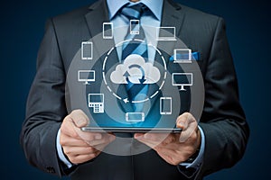 Businessman holding tablet showcasing cloud computing and device synchronization for business solutions
