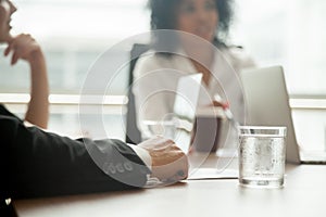 Businessman in suit participating group meeting or negotiations,