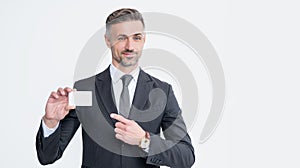 businessman in suit point finger on business card isolated on white background