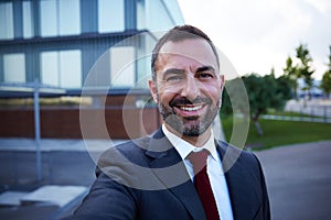Businessman in a suit selfie