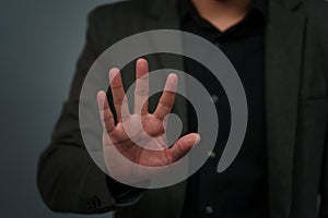 businessman in suit showing five fingers or fingerprint scan touching