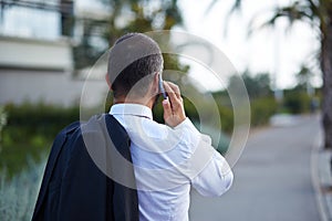 Businessman in a suit talking on the phone