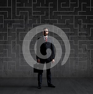 Businessman in suit and tie. Black background with copyspace. Bu