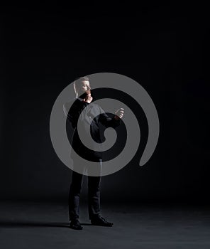 Businessman in a suit and tie writing something