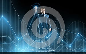 Businessman in suit touching virtual graph