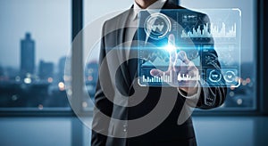 Businessman interacting with futuristic digital interface displaying data and analytics