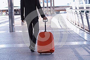 Businessman and suitcase in the airport departure lounge , traveler suitcases in airport terminal