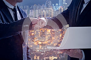 Businessman in suits making fist bump at the office, Power of cooperation and business success team concept, double exposure of