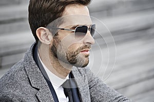 Businessman in sunglasses, profile