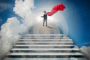 The businessman superhero successful in career ladder concept