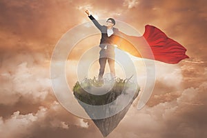 Businessman superheroes wearing red hero cape standing on island floating in air,sunset sky background,professional business