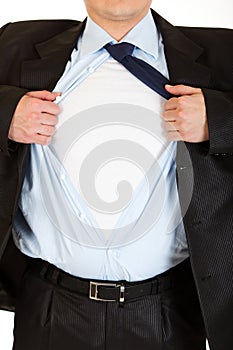 Businessman superman tearing his shirt. Close-up.