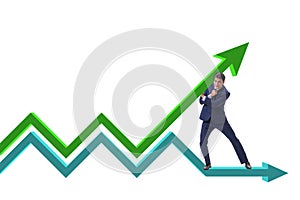 The businessman supporting growtn in economy on chart graph