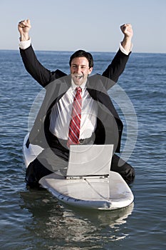 Businessman on Surfboard