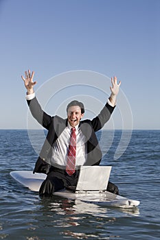 Businessman on Surfboard