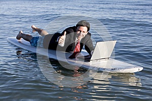 Businessman on Surfboard