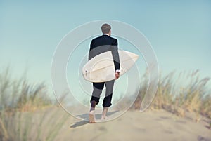 Businessman with Surfboard Going to the Beach