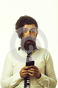 Businessman with surprised face hold mobile phone