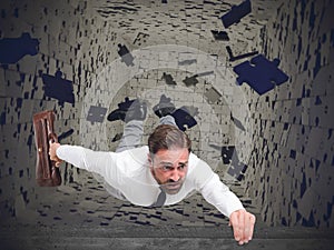 Businessman swallowed from instability photo