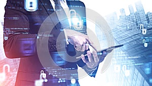 Businessman with tablet in city, cyber security