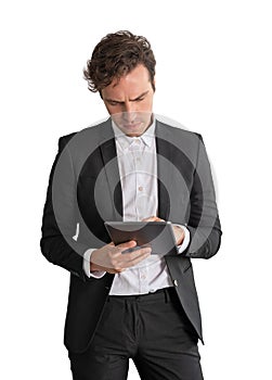 Businessman with tablet in hand, isolated over white background