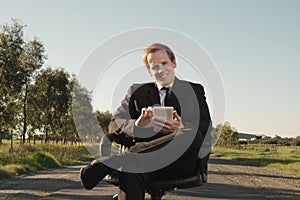 Businessman with tablet outdoor