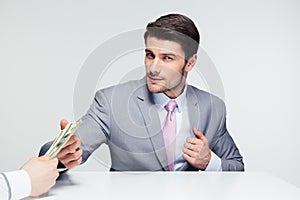 Businessman taking bribe photo