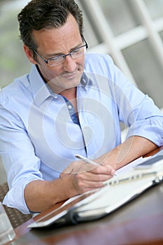 Businessman taking down notes