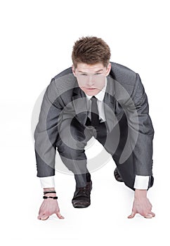 Businessman taking low start to running. On white background.