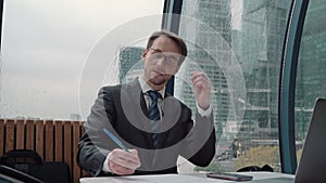 Businessman taking notes or signing contract, pen and document, man in formal jacket. Close up hand