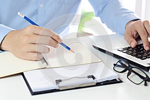 Businessman taking notes Summarize the meeting online with laptop.