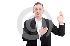 Businessman taking oath or making a promise