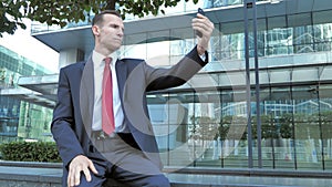 Businessman Taking Selfie on Phone