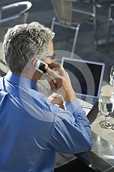 Businessman talking on cellphone.